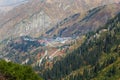 Autumn landscape of the small Almaty gorge overlooking the Shymbulak ski base.